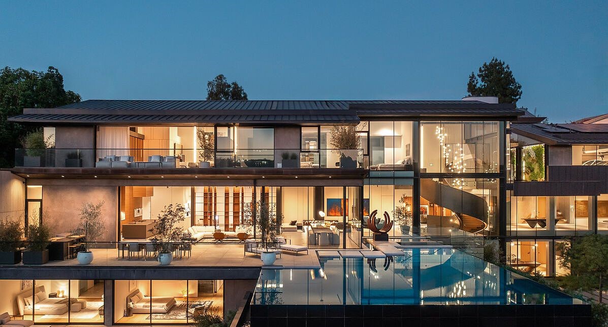 The residence at dusk with infinity pool